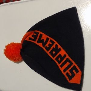1 Black & Orange Knitted Supreme Beanie w/Orange pom. Gently Used. Unisex.